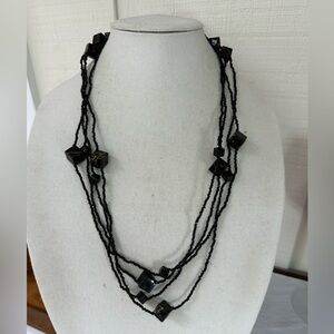 Two ultra long black seed bead and cube necklaces